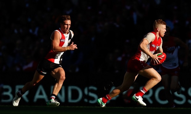 AFL 2017 Round 09 - St Kilda v Sydney MELBOURNE, AUSTRALIA - MAY 20: Dan Hannebery of the Swans is chased by Luke Dunstan of the Saints during the 2017 AFL round 09 match between the St Kilda Saints and the Sydney Swans at Etihad Stadium on May 20, 2017 in Melbourne, Australia. (Photo by Michael Willson/AFL Media)